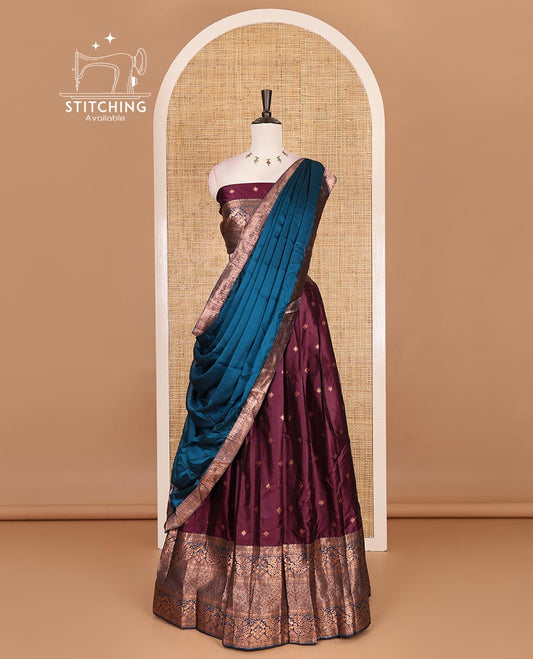 Wine taffeta silk half saree, zari buttas with contrast blue traditional zari border skirt, matching zari design blouse, and contrast plain zari border syska georgette dhavani