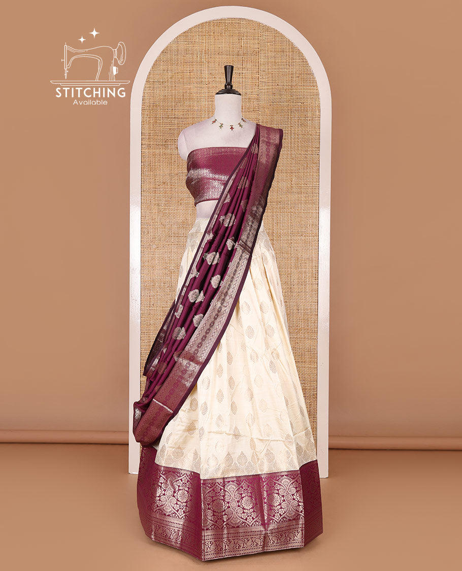Cream with purple semi-banarasi half-saree, zari buttas with contrast traditional zari border skirt, zari jacquard blouse, and zari design dhavani