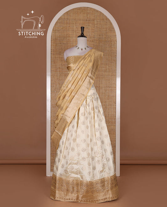 Cream and gold  semi-banarasi half-saree, zari buttas with contrast swarovski stone work border skirt, contrast zari buttas blouse, and intricate zari dhavani