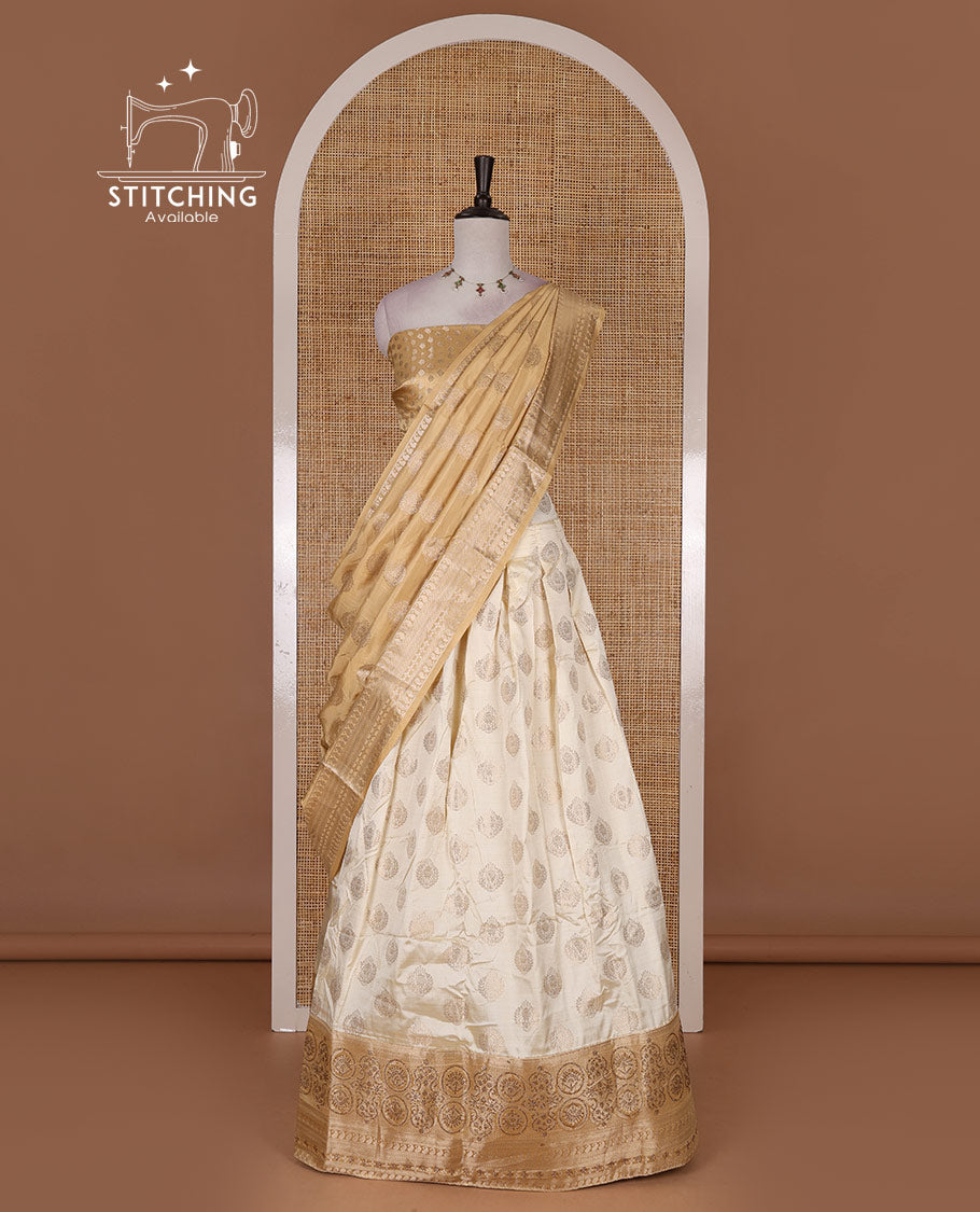 Cream and gold  semi-banarasi half-saree, zari buttas with contrast swarovski stone work border skirt, contrast zari buttas blouse, and intricate zari dhavani