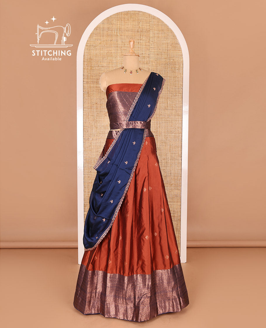 Rust taffeta silk half-saree, zari buttas and contrast traditional zari bordered skirt, a matching taffeta silk blouse, and contrast embroidered satin georgette  dhavani