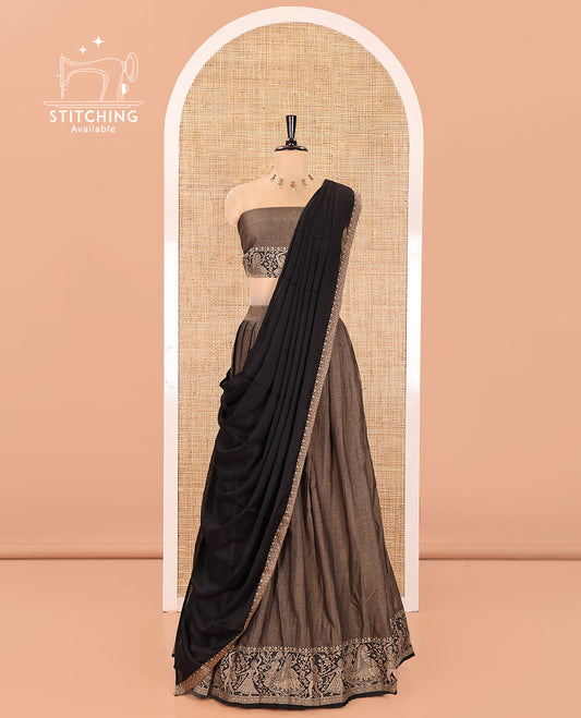 Chikku and Black Mercerised Cotton Half-Saree Set, Plain with Dancing Figurines Woven Bordered Skirt, Paired With a Matching Blouse, and Comes with a Contrast Dhavani