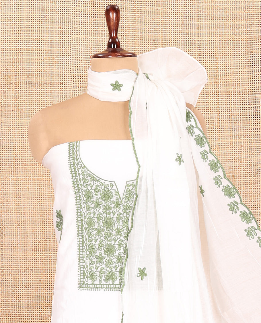White-Leaf Green Mul Chanderi Material Churidar Features a Floral-Themed Thread-Embroidered Top, a Plain Santoon Bottom, and Thread Embroidered Dupatta