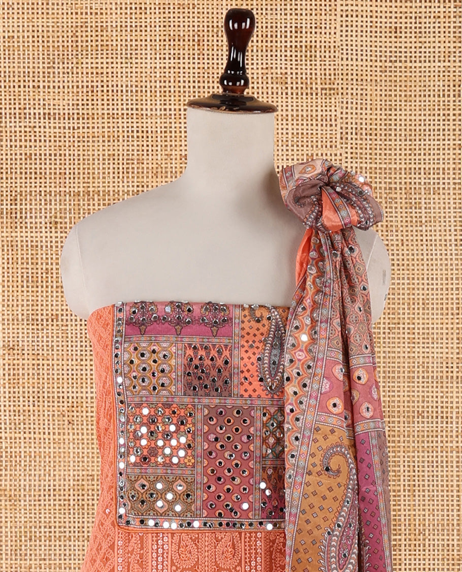 Orange churidar material set, Ajrakh-printed neck with Schiffli embroidery & mirror work georgette top, kalidoscopic-colored dupatta of ajrakh print & mirror embroidery & plain crepe bottom