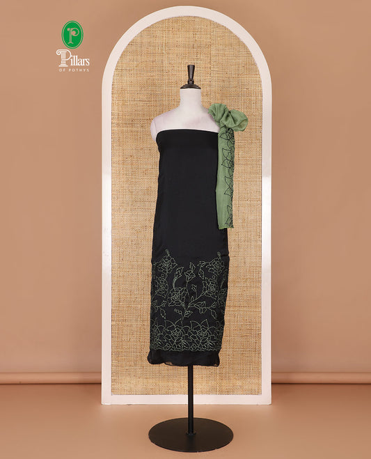 Black and green organza material churidar set, Lucknowi chikankari floral vine embroidery top, plain bottom, and contrast floral embroidery dupatta