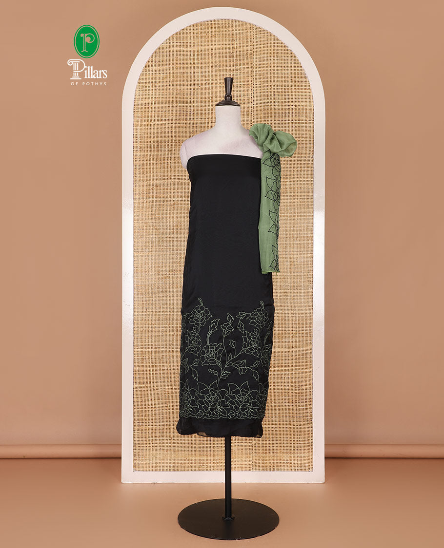 Black and green organza material churidar set, Lucknowi chikankari floral vine embroidery top, plain bottom, and contrast floral embroidery dupatta