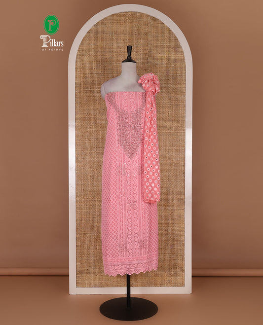 Dark peach material churidar set, stone work with Schiffli style embroidered georgette top, American Crape bottom, and polka dotted printed mirror work dupatta