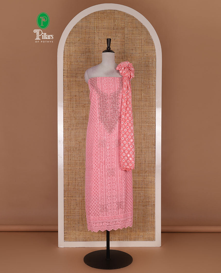 Dark peach material churidar set, stone work with Schiffli style embroidered georgette top, American Crape bottom, and polka dotted printed mirror work dupatta