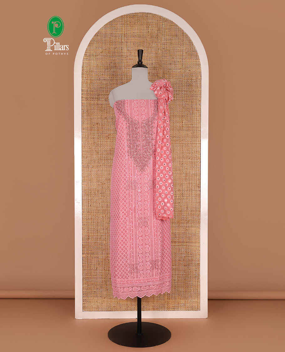 Dark peach material churidar set, stone work with Schiffli style embroidered georgette top, American Crape bottom, and polka dotted printed mirror work dupatta