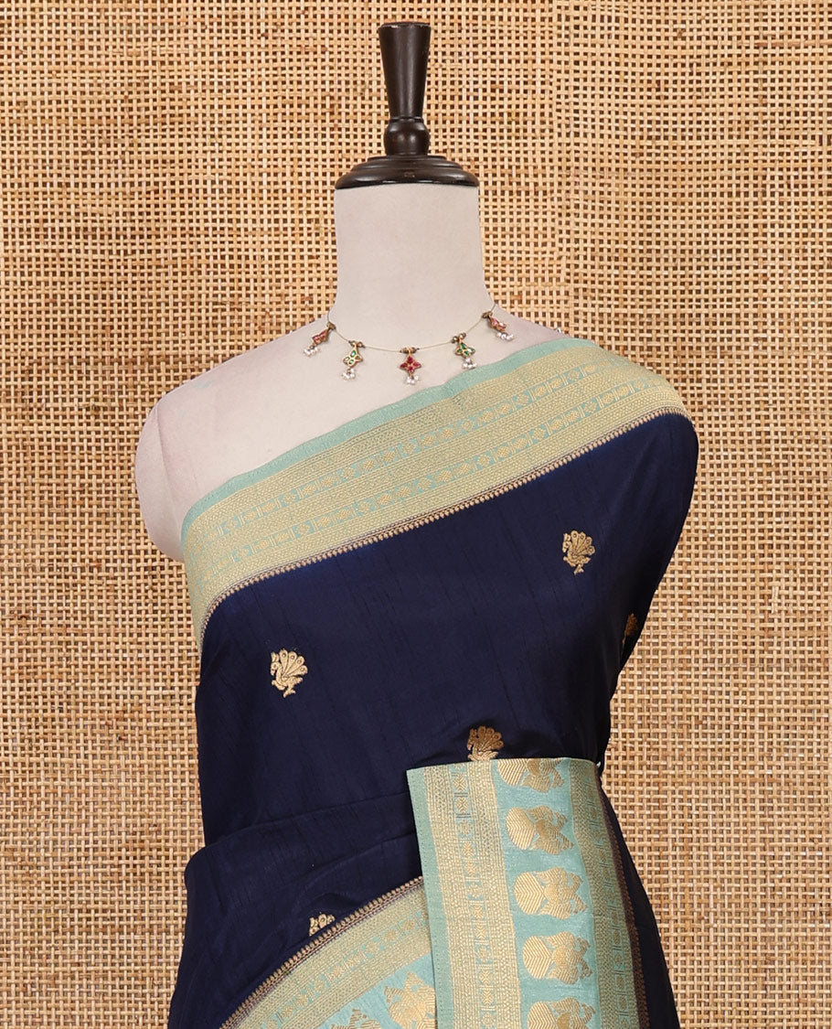 Navy blue peacock buttas dola silk saree, contrast rudraksham & iruthalai pakshi border, intricate pallu & contrast jacquard blouse