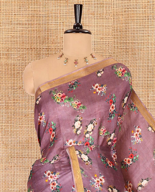 Grape-color colorful floral bunches printed banana pith saree, piping zari border, striped pallu, and a printed blouse