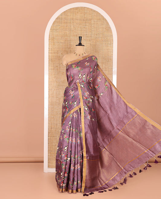 Grape-color colorful floral bunches printed banana pith saree, piping zari border, striped pallu, and a printed blouse