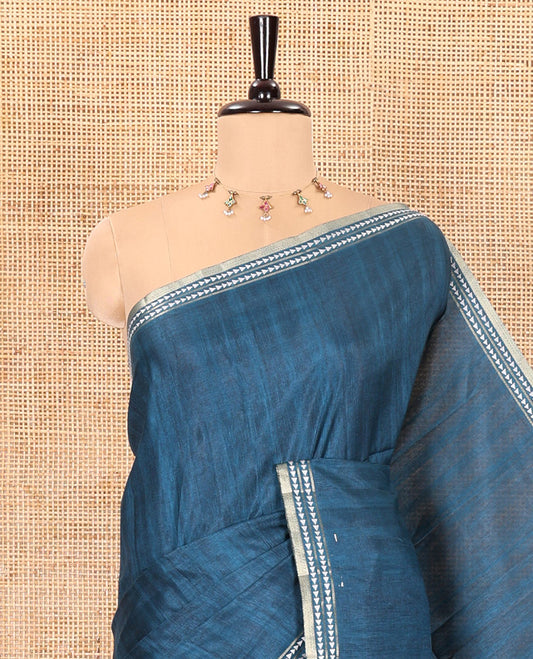 Peacock blue plain fancy tussar saree, temple motifs woven thread border, striped pallu, and a matching blouse