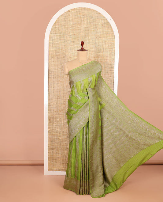 Green Fancy Khaddi Georgette Entralled with Geometric Patterns in Zari, Subtly Woven Border Steeped with Traditional Designs, Richly Woven Pallu of Jaal Designs, and Paired with a Matching Blouse