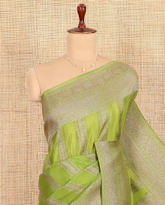 Green Fancy Khaddi Georgette Entralled with Geometric Patterns in Zari, Subtly Woven Border Steeped with Traditional Designs, Richly Woven Pallu of Jaal Designs, and Paired with a Matching Blouse
