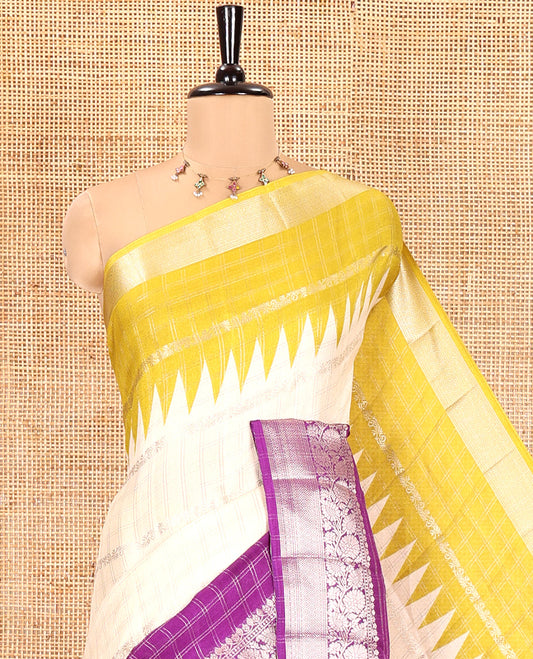 Off-White Fancy Georgette Saree, Gleamed Up with Zari Designs, Complemented by a Contrast Ganga-Jamuna Zari Temple Border of Traditional Designs, Pallu of Paisleys, and Paired with a Contrast Blouse