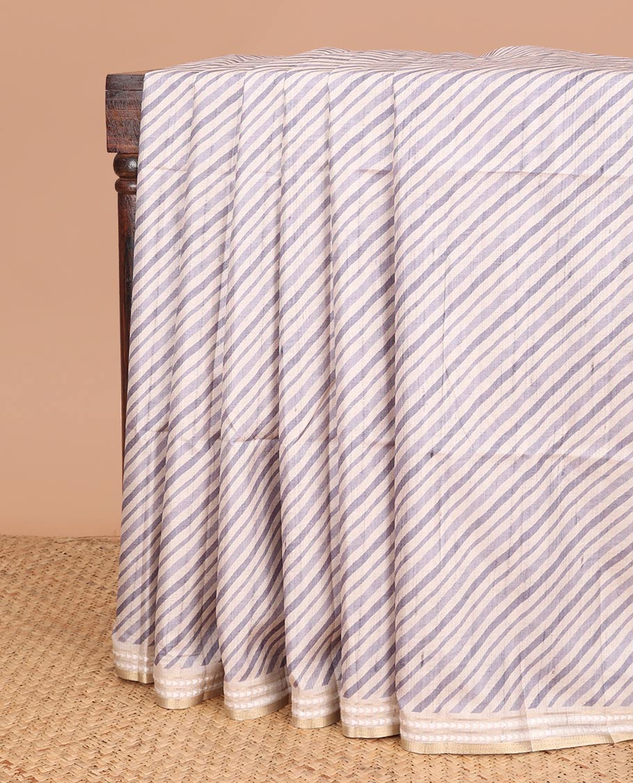 Grey geometrical block print fancy tussar saree with zari diamond thread woven border & block print pallu along with printed blouse