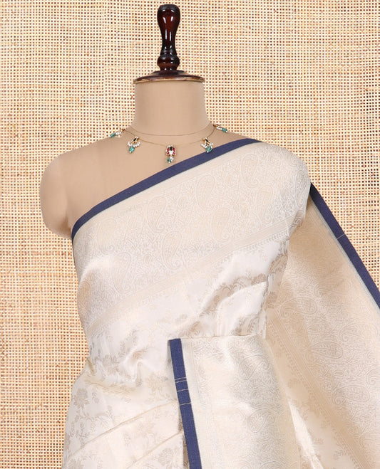 Off-White-Navy Semi-Silk Saree, Adorned with Floral Jacquard Design, a Zari Paisley Border, and a Contrast Blouse