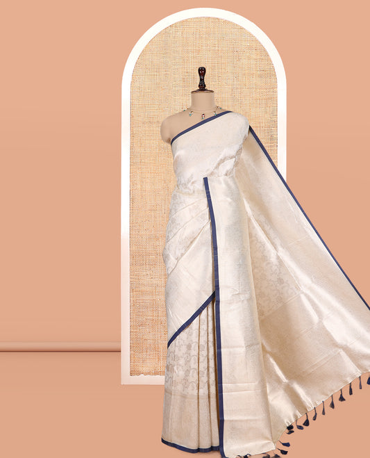 Off-White-Navy Semi-Silk Saree, Adorned with Floral Jacquard Design, a Zari Paisley Border, and a Contrast Blouse