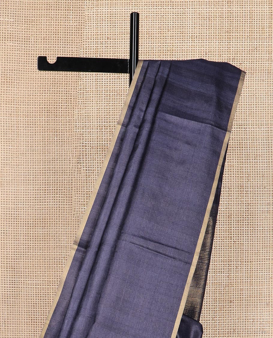 Borderless metallic blue sparsely striped tussar silk saree, striped pallu