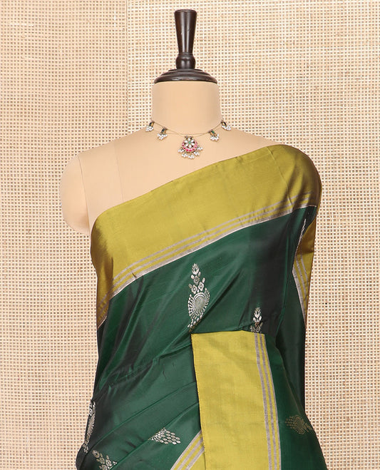 Green Semi Uppada Saree Elegantly Framed with Zari Buttas, Complemented by a Contrasting Border, Richly Detailed Pallu of Ogee Patterns, and Paired with a Contrast Blouse