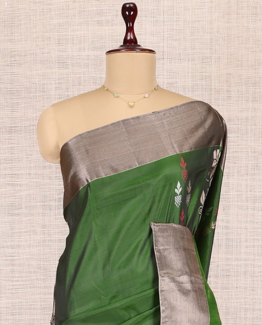 Green Uppada Saree, Detailed with Zari Buttas, a Contrast Bavanji Border, Grand Jaal Pallu, and a Contrast Blouse