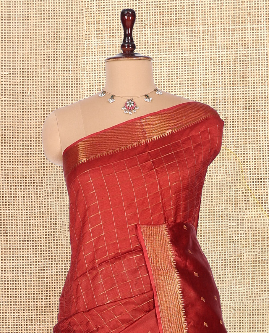Rust Banana Pith Saree, Gleamed Up with Checks and Buttas, a Zari Temple Border, Striped Pallu, and Matching Blouse