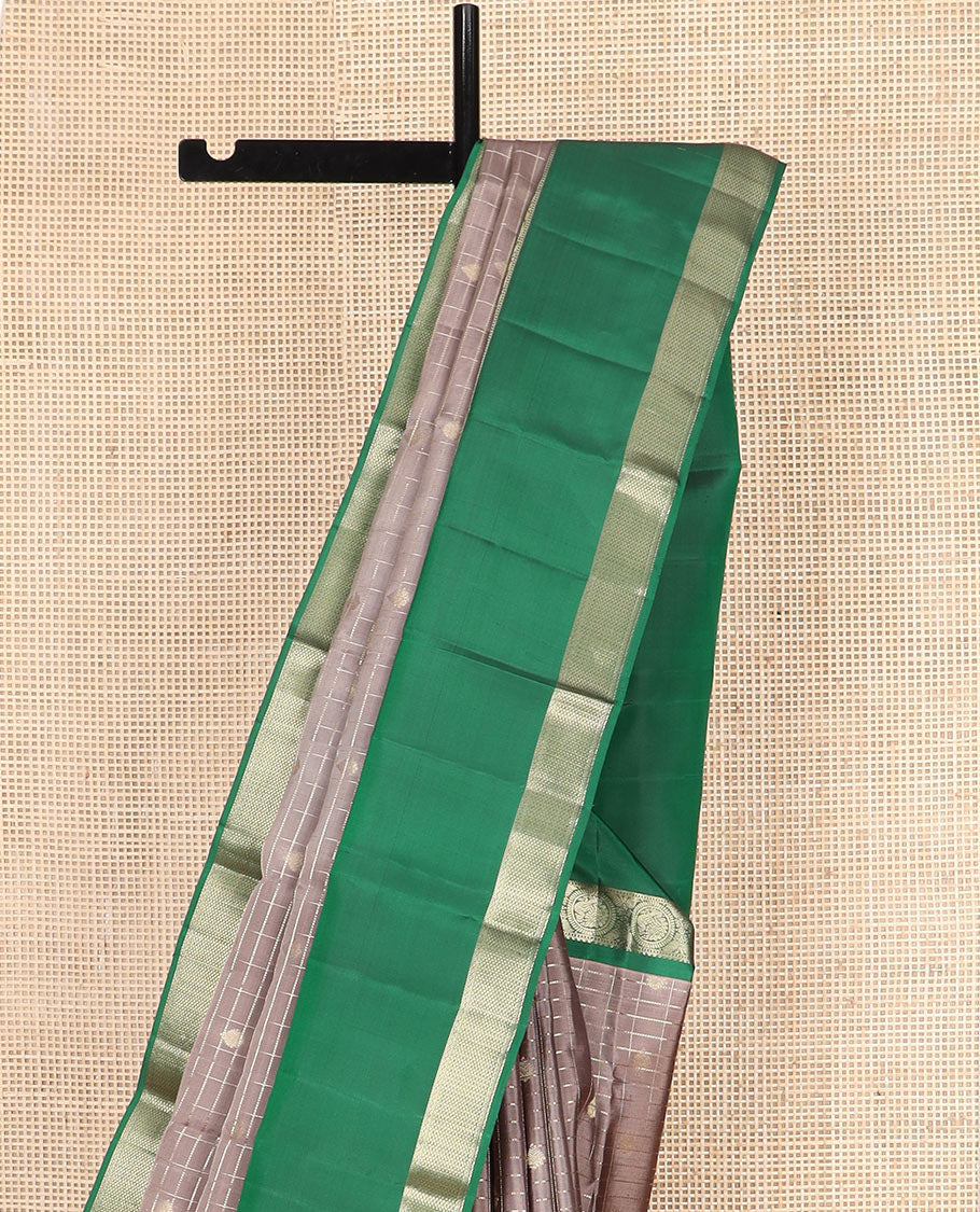 Brown Vasundhara Silk Saree Gleamed Up with Zari Butta Enclosed Checks, Complemented by a Contrast Rettai Pettu Blouse of Rekku, Round Mayil, Neli, and Mayil Kann Designs, Pallu Embellished with Jaal Designs, and Paired with a Contrast Blouse