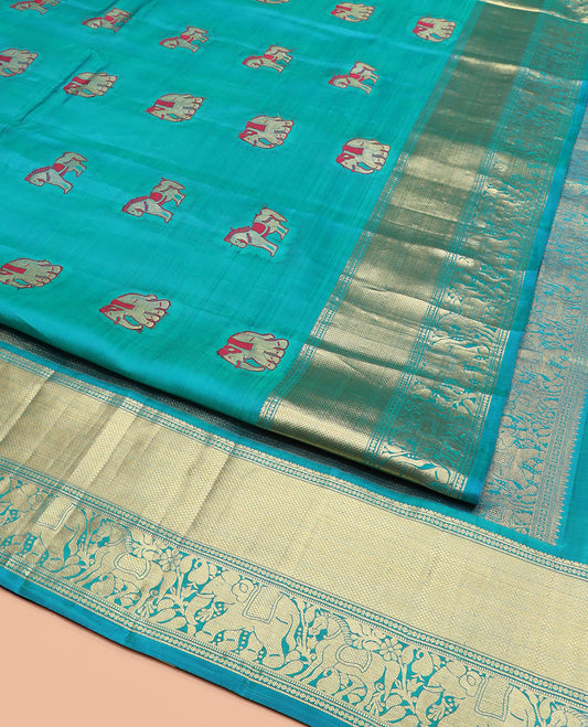 Blue Vasundhara Silk Saree Woven with Yaanai and Kuthirai Meena Buttas, Complemented by a Zari Border of Mayil Kann, Yaanai and Kuthirai Designs, Gleamed-Up Pallu of Zari Designs, and Paired with a Matching Zari-Bordered Blouse
