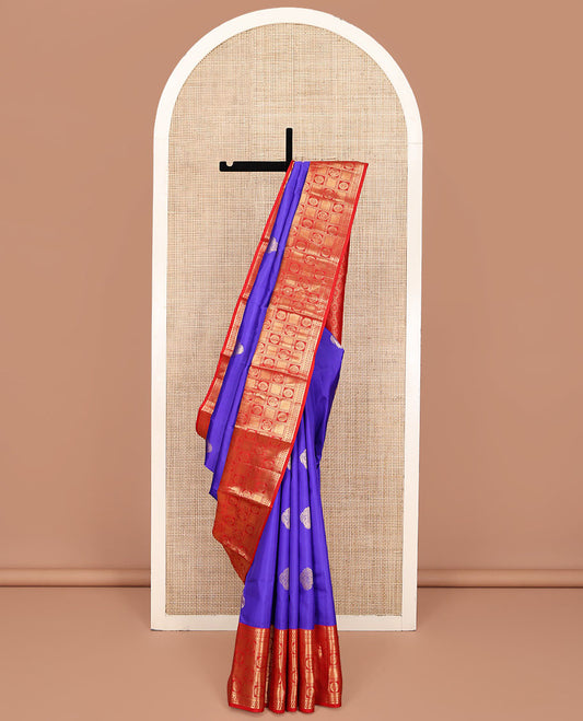 Violet Vasundhara Silk Saree, Prettified with Zari Buttas All Over Its Body, Complemented by a Contrast Border of Rekku, Banaras, Kathir, Chakram, Round Mayil, and Mayil Kann Designs, Grand Ogee-Patterned Pallu, and Paired with a Contrast Blouse