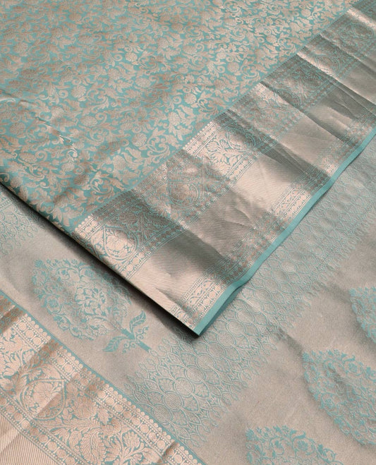Blue jacquard Kanchipuram wedding silk saree, zari border of thilakam, muthu, poun, banaras, mayil, kodi visiry, leaf vine and zari designs, and intricate pallu