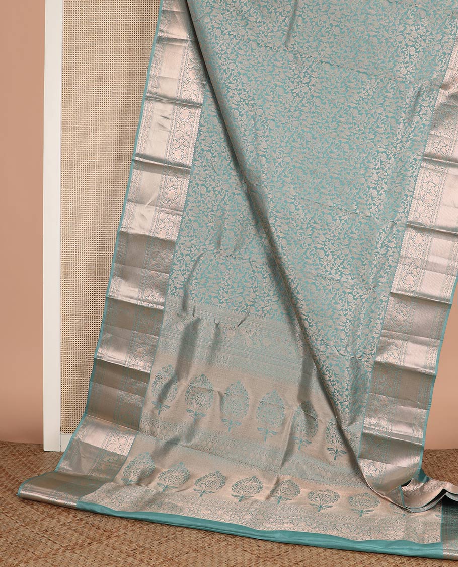 Blue jacquard Kanchipuram wedding silk saree, zari border of thilakam, muthu, poun, banaras, mayil, kodi visiry, leaf vine and zari designs, and intricate pallu