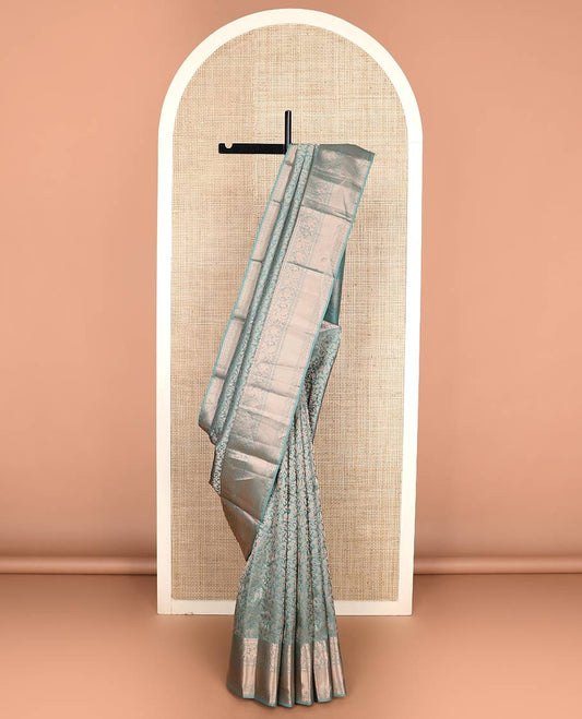 Blue jacquard Kanchipuram wedding silk saree, zari border of thilakam, muthu, poun, banaras, mayil, kodi visiry, leaf vine and zari designs, and intricate pallu