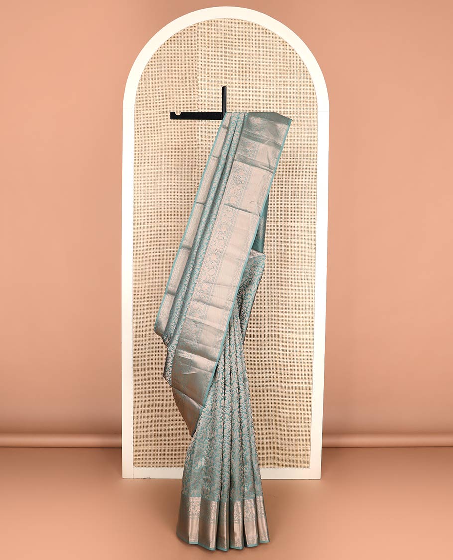 Blue jacquard Kanchipuram wedding silk saree, zari border of thilakam, muthu, poun, banaras, mayil, kodi visiry, leaf vine and zari designs, and intricate pallu