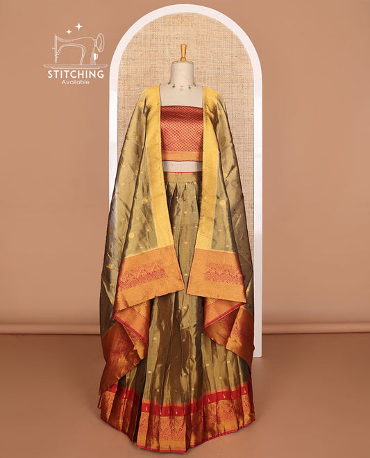 Olive green buttas tissue half saree with contrast zari design border, checked zari design blouse & floral design dhavani