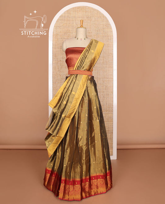 Olive green buttas tissue half saree with contrast zari design border, checked zari design blouse & floral design dhavani