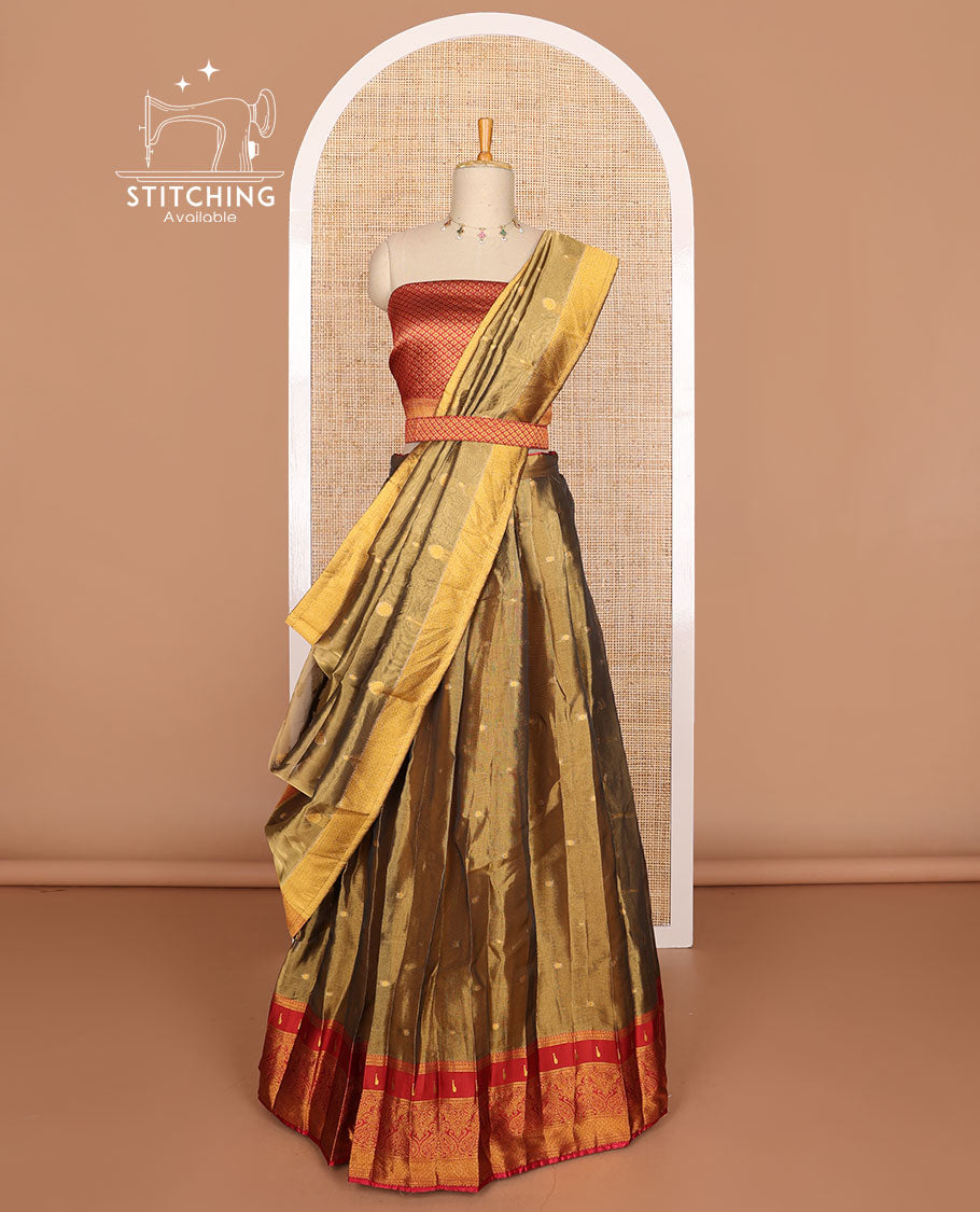 Olive green buttas tissue half saree with contrast zari design border, checked zari design blouse & floral design dhavani