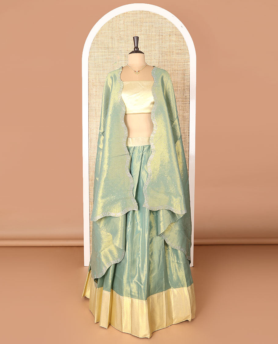 Green art-silk half-saree, plain with contrast bordered skirt, contrast blouse, and a scallop stone work dhavani