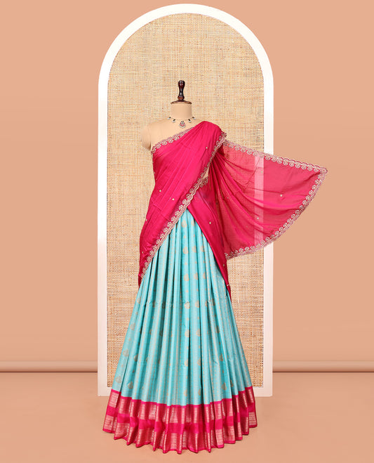 Blue Art Silk Half-Saree Pavadai Material Features a Zari-Design Skirt, a Contrast Traditional Border, Contrast Blouse, and Scallop Embroidered Dhavani