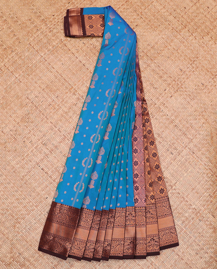 Blue Budget Silk Saree Features Zari Buttas, Complemented by a Contrasting Traditional Zari Design Border, a Pallu Adorned with Jaal Designs, and a Contrasting Zari-Bordered Blouse.
