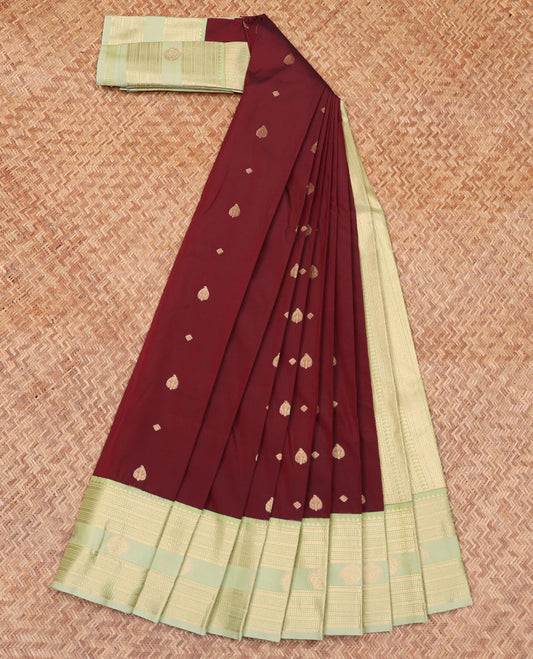 Maroon Budget Silk Saree, Decked Up with Zari Buttas All Over Its Body, Complemented by a Contrast Traditional Zari Design Border, Opulently Embellished Pallu, and Paired with a Contrast Blouse