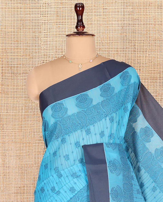 Blue Semi-Silk Cotton Saree, Sparsely Woven with Floral Designs All Over Its Body, Complemented by Contrast Border, Sparsely Woven Pallu of Intricate Designs, and Paired with a Matching Blouse