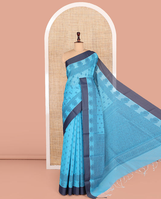 Blue Semi-Silk Cotton Saree, Sparsely Woven with Floral Designs All Over Its Body, Complemented by Contrast Border, Sparsely Woven Pallu of Intricate Designs, and Paired with a Matching Blouse