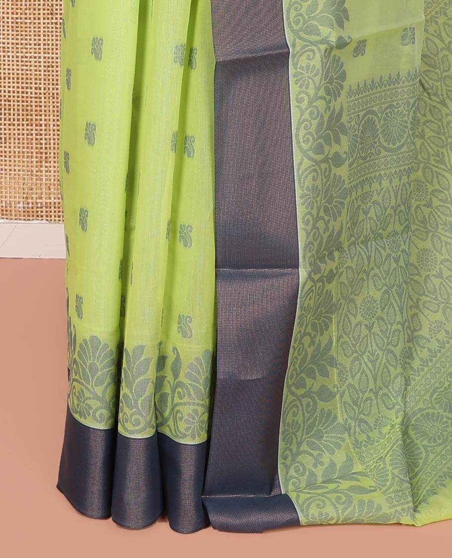 Green Semi-Silk Cotton Saree, Sparsely Woven with Floral Buttas on Its Body, Complemented by Contrast Border, Pallu Steeped with Floral Designs, and Paired with a Matching Blouse