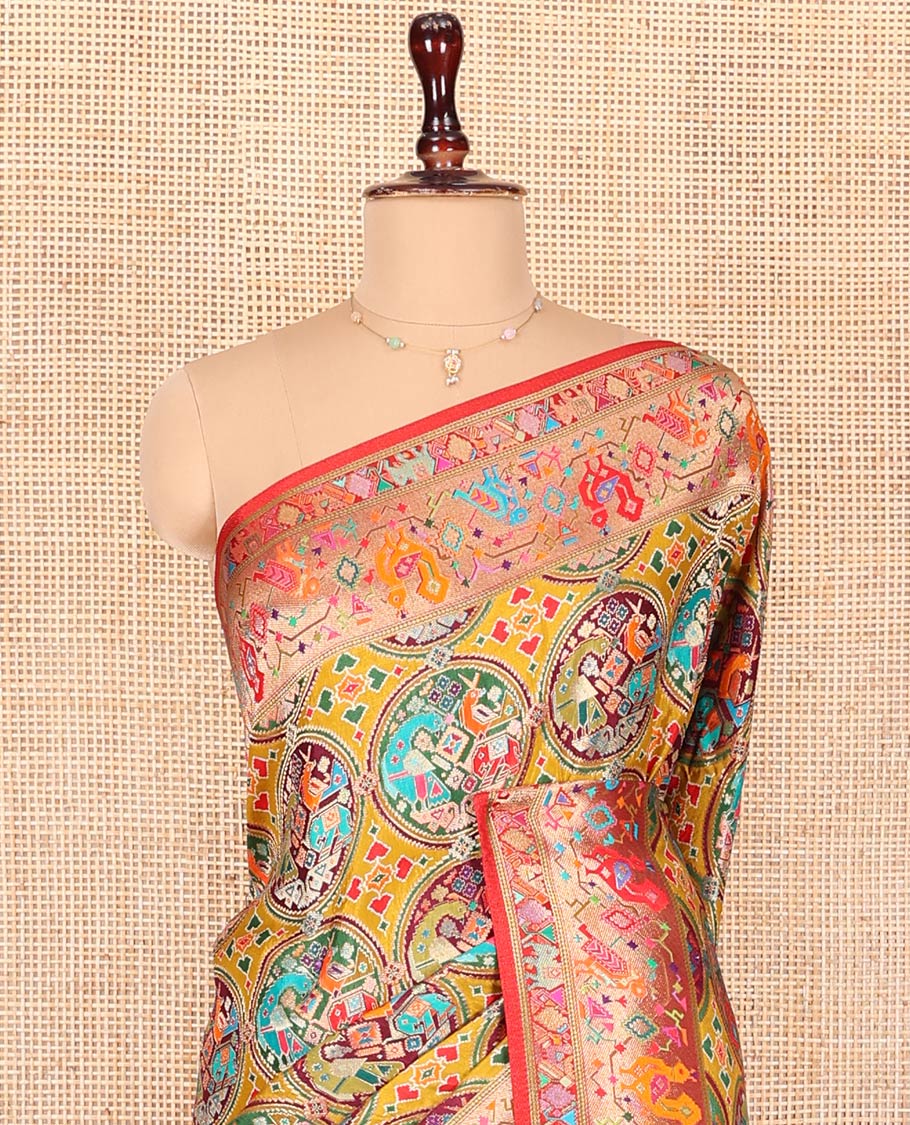 Multi-Color Dola Silk Saree, Artfully Printed with Colorful Patola-Style Animal Motifs on Its Body, Complemented by Contrast Patola-Style Zari and Print Border, Pallu of Paisleys, and Paired with a Contrast Blouse