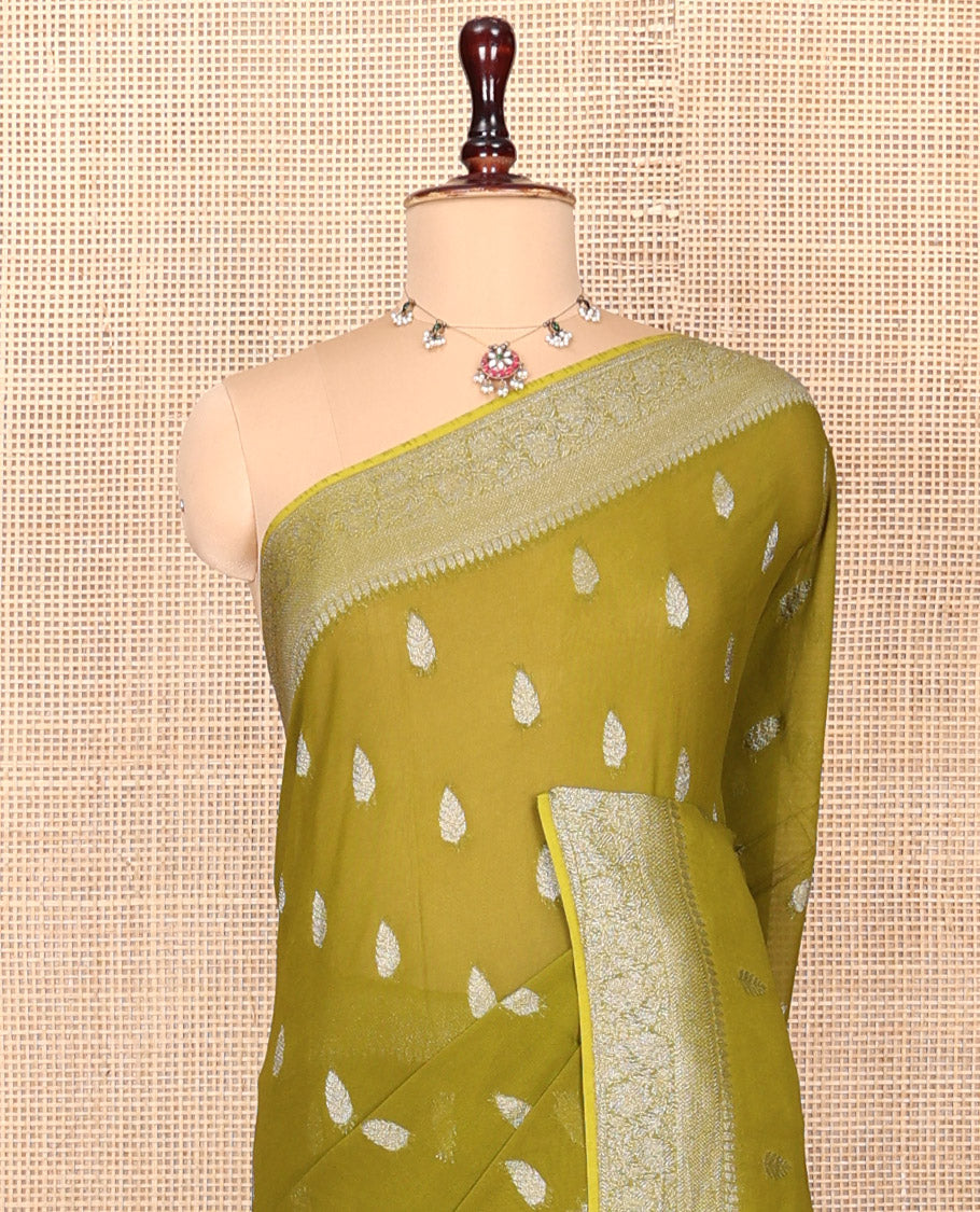 Green Georgette Saree, Steeped with Buttas, Highlighted by a Traditional Floral Creeper Border, Intricately Designed Pallu, and  a Matching Blouse