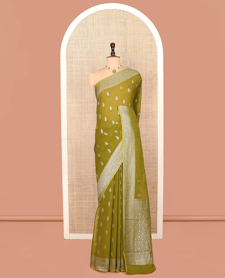 Green Georgette Saree, Steeped with Buttas, Highlighted by a Traditional Floral Creeper Border, Intricately Designed Pallu, and  a Matching Blouse