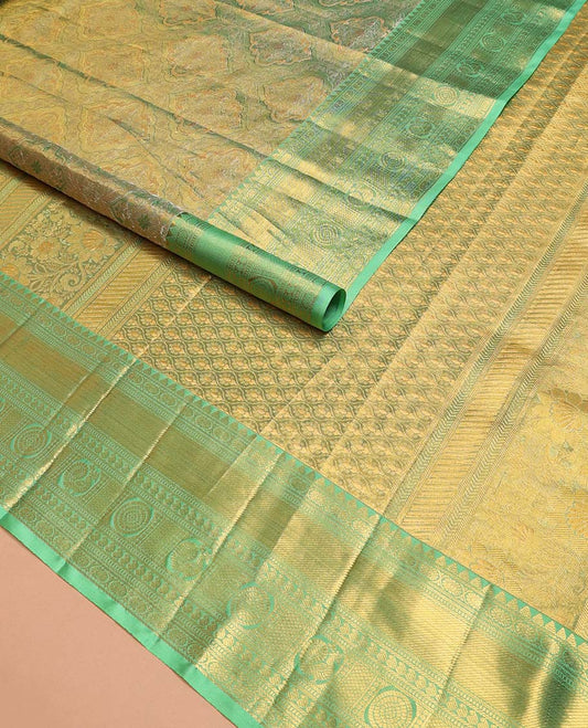 Green Kanchipuram Tissue Silk Saree, Elevated with Jacquard Design on Its Body, Complemented by a Contrast Border of Rekku, Kamalam, Banaras, Muthu, Manga, Mayil, and Mayil Kann Designs, Grand Ogee Pallu, and Paired with a Contrast Blouse