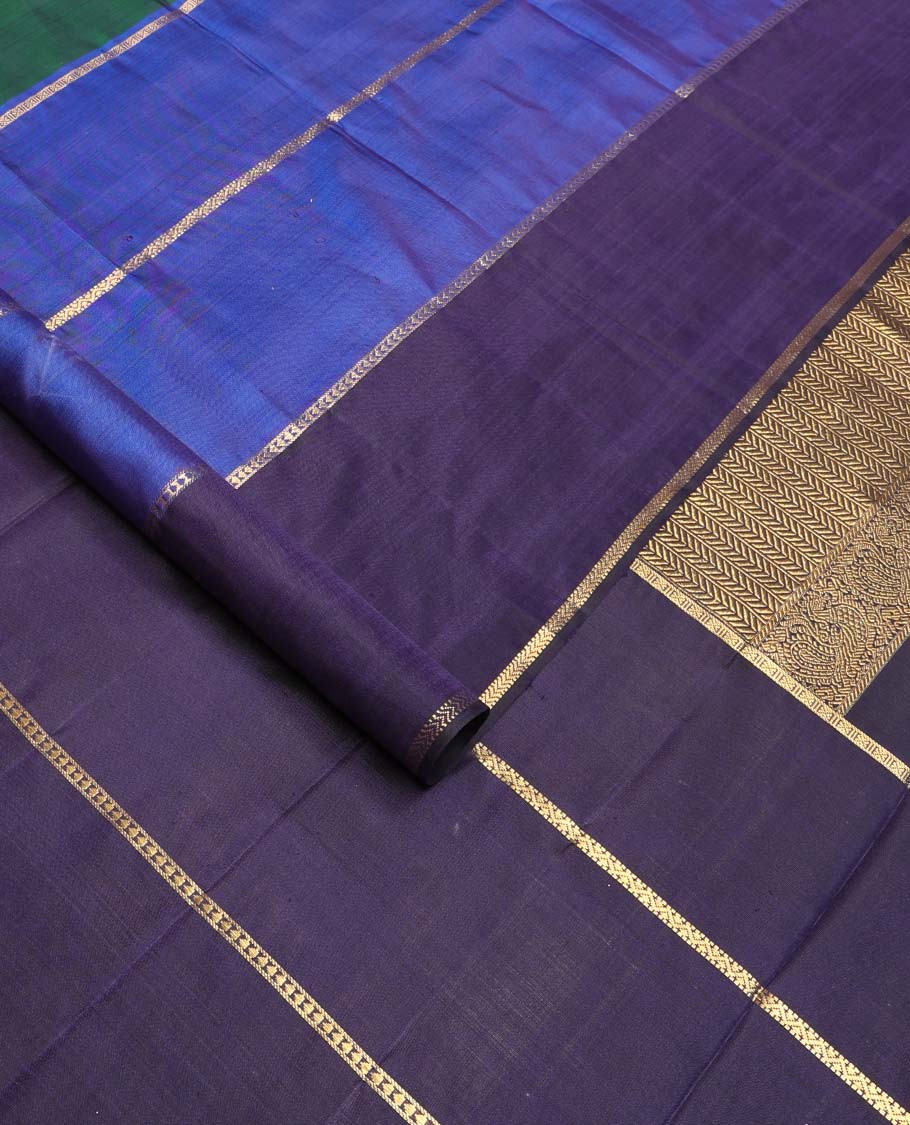 Green kili buttas Kanchipuram silk saree, contrast border of lavangam, muthu, neli, ara bogudi, and kathir stripes, and kathir design pallu