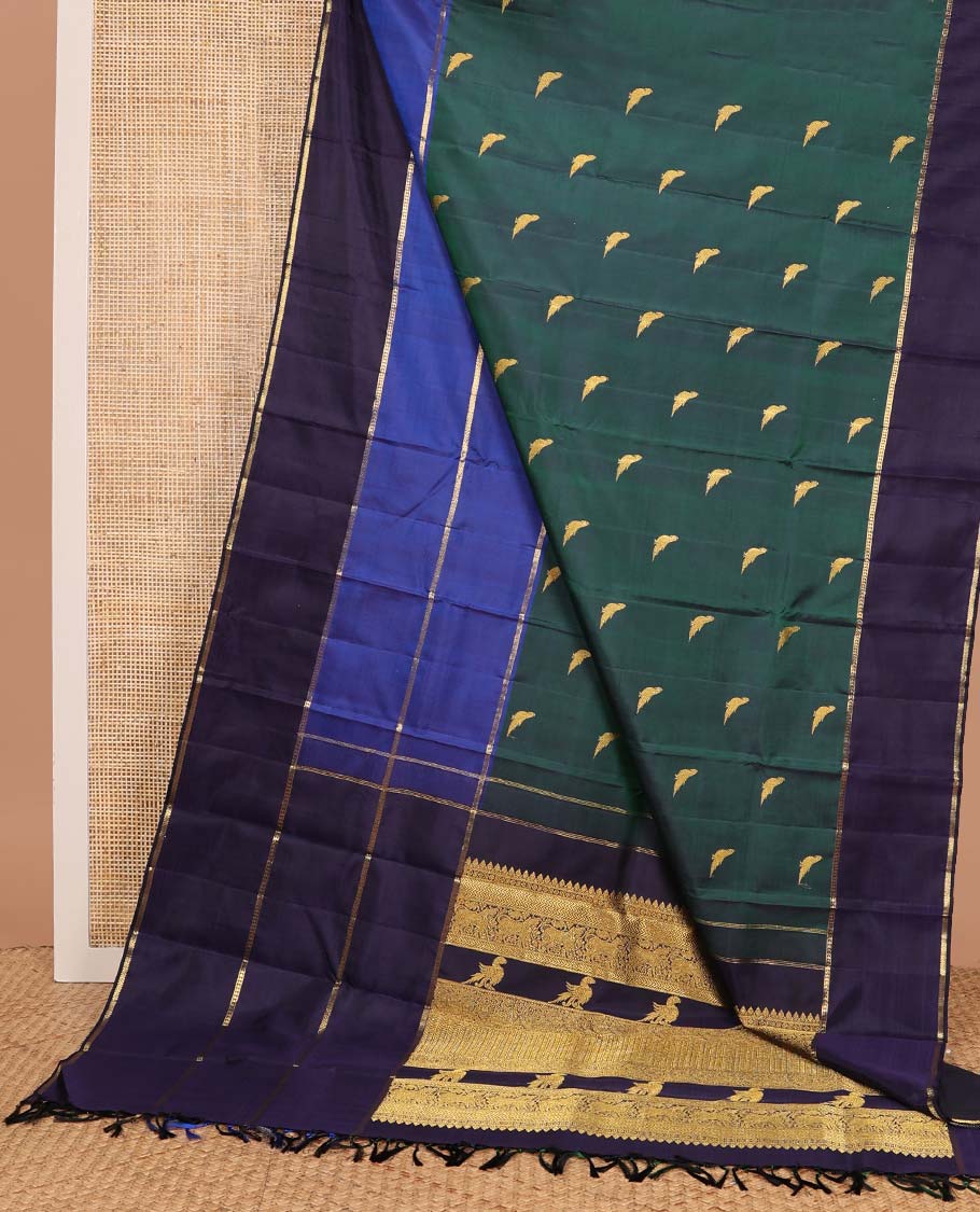 Green kili buttas Kanchipuram silk saree, contrast border of lavangam, muthu, neli, ara bogudi, and kathir stripes, and kathir design pallu